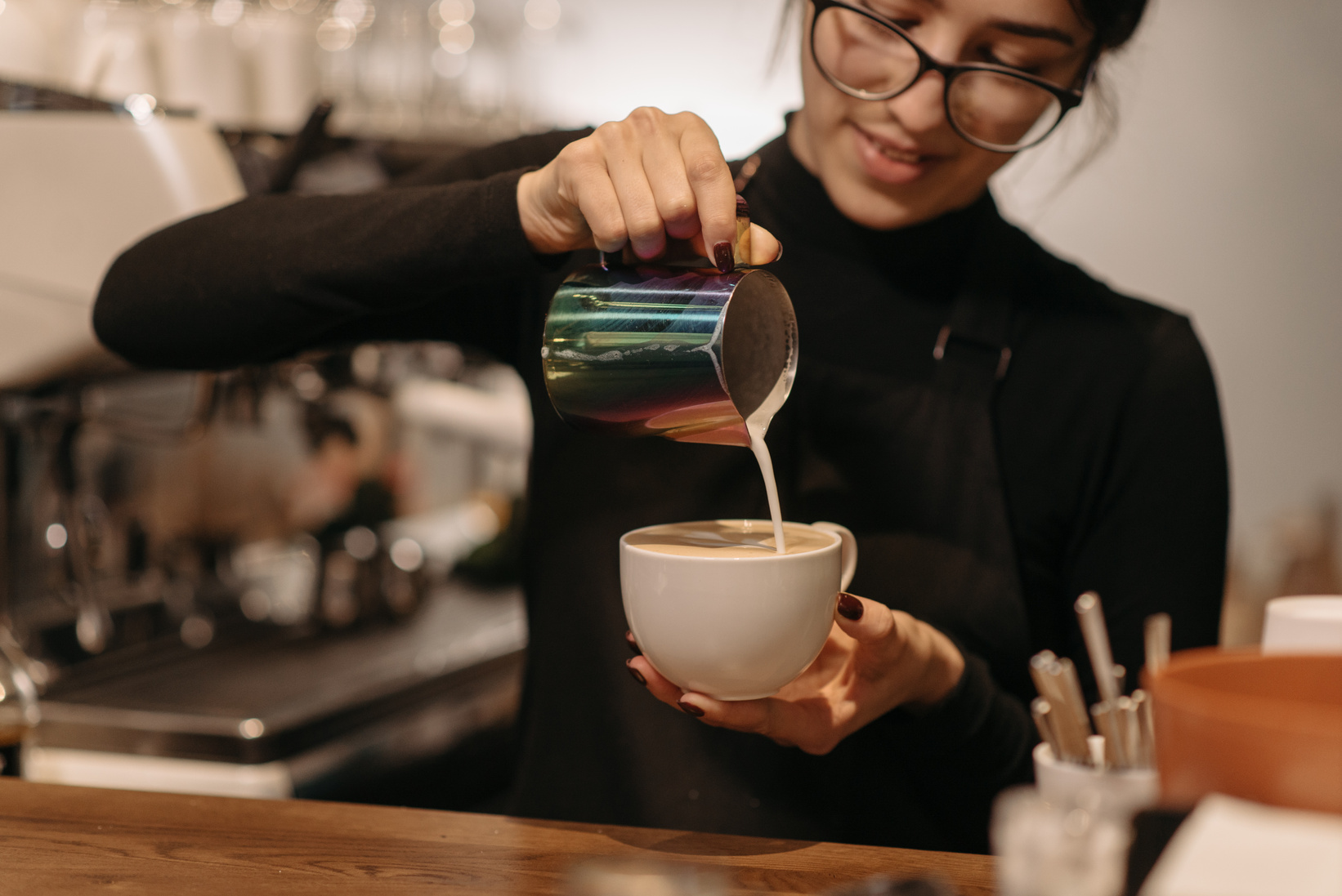 A Female Barista Making Coffee